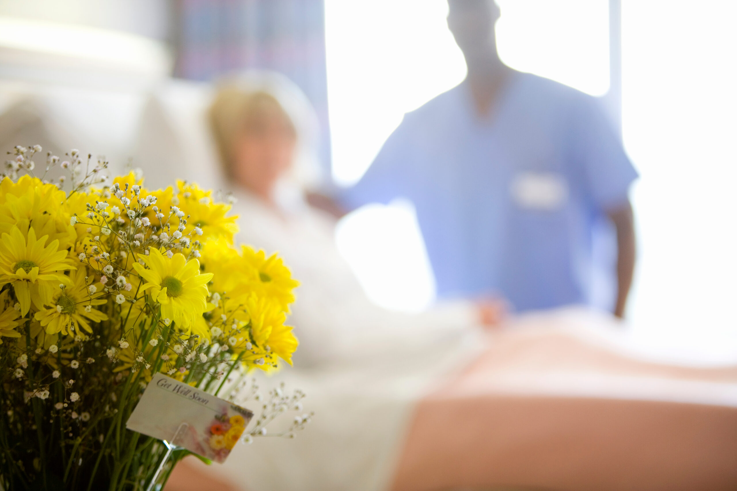 male-nurse-standing-next-to-a-senior-female-patien-2026-01-11-08-43-20-utc